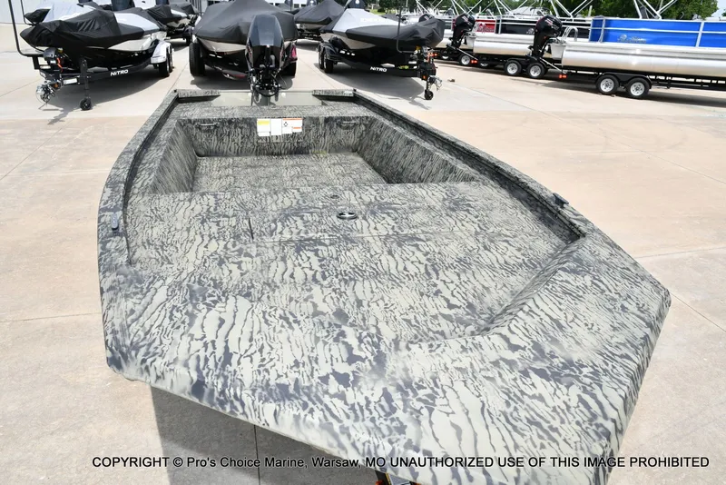 Slide: The Image of 2026 Tracker Grizzly 1648 Jon boat on a parking lot. - 16
