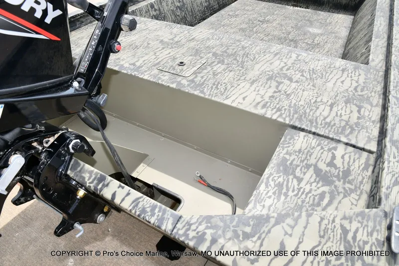 Slide: The Image of Tracker Grizzly 1648 Jon 2026 with Mercury motor, interior view. - 23