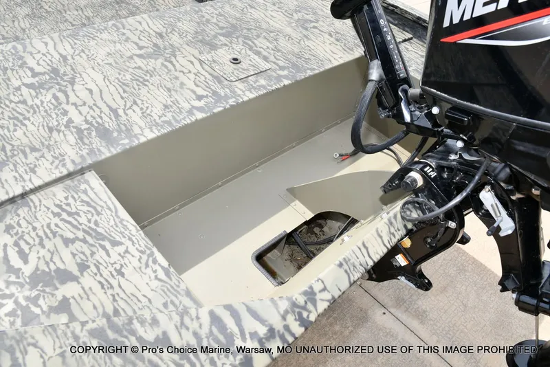 Slide: The Image of Tracker Grizzly 1648 Jon 2026 with outboard motor, detailed view. - 24