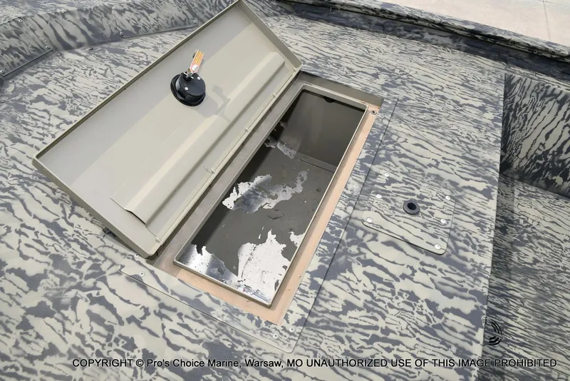 Slide: The Image of Tracker Grizzly 1648 Jon 2026 with open storage compartment. - 34