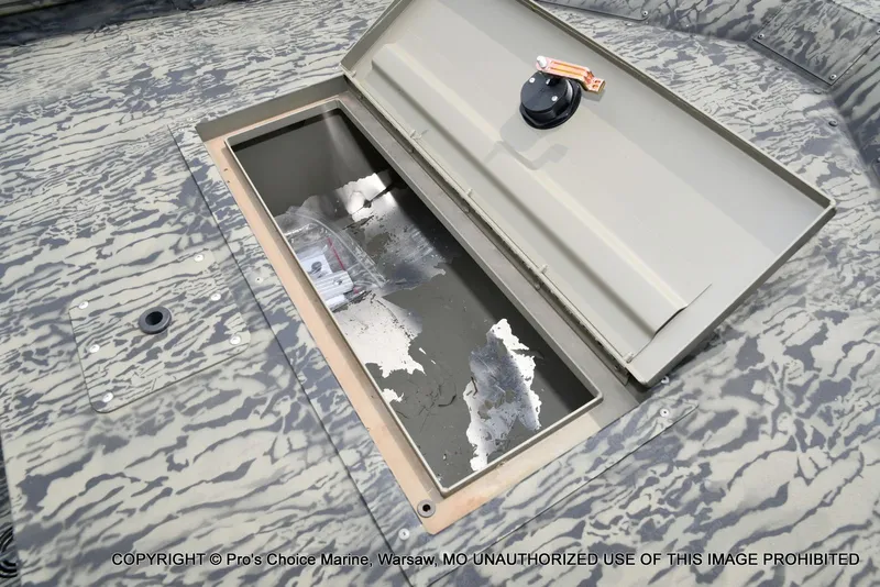 Slide: The Image of Open storage compartment in Tracker Grizzly 1648 Jon boat, 2026 model. - 35