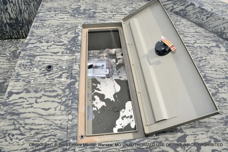 Slide: The Image of Tracker Grizzly 1648 Jon 2026 with open storage compartment lid. - 36
