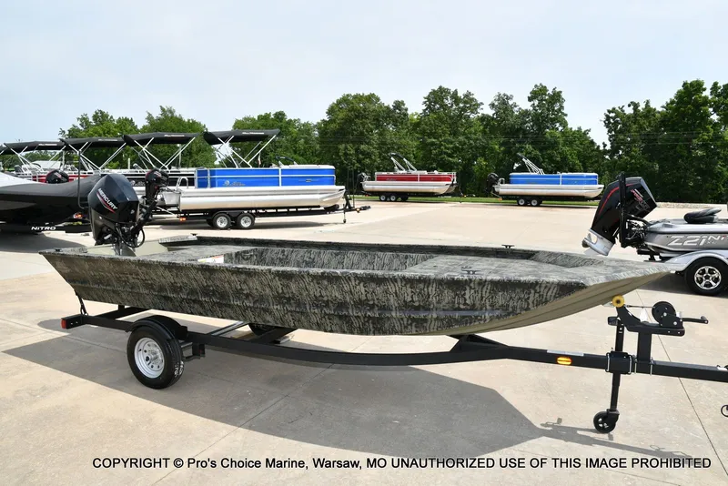 Slide: The Image of 2026 Tracker Grizzly 1648 Jon boat on trailer outdoors. - 38