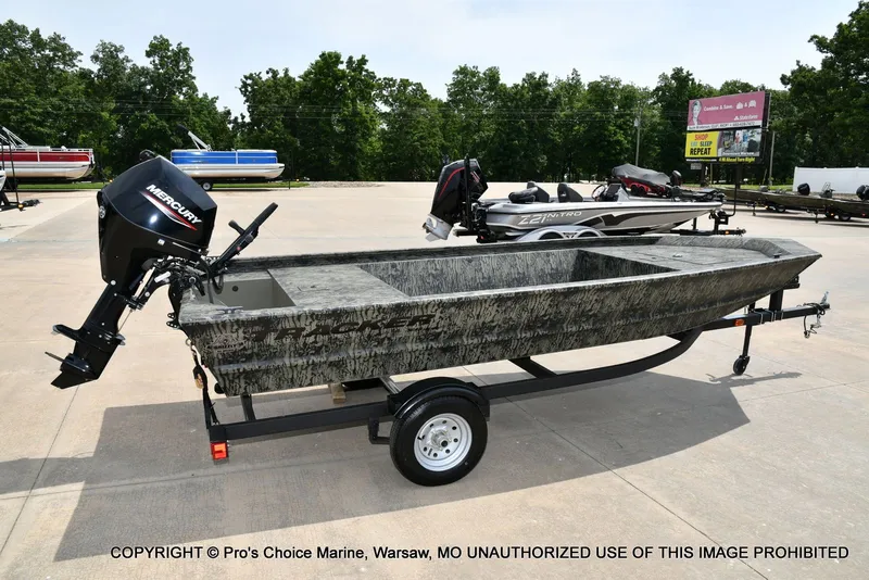 Slide: The Image of 2026 Tracker Grizzly 1648 Jon boat with Mercury motor on trailer. - 5