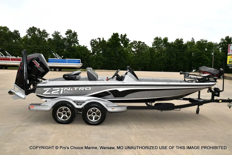 Slide: The Image of 2024 Nitro Z21 XL Pro boat on trailer, side view. - 21