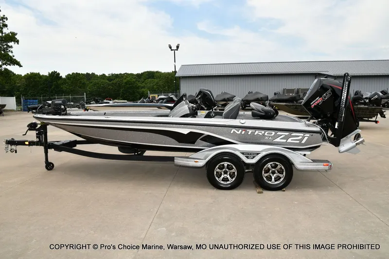 Slide: The Image of 2024 Nitro Z21 XL Pro boat parked on trailer outdoors. - 27
