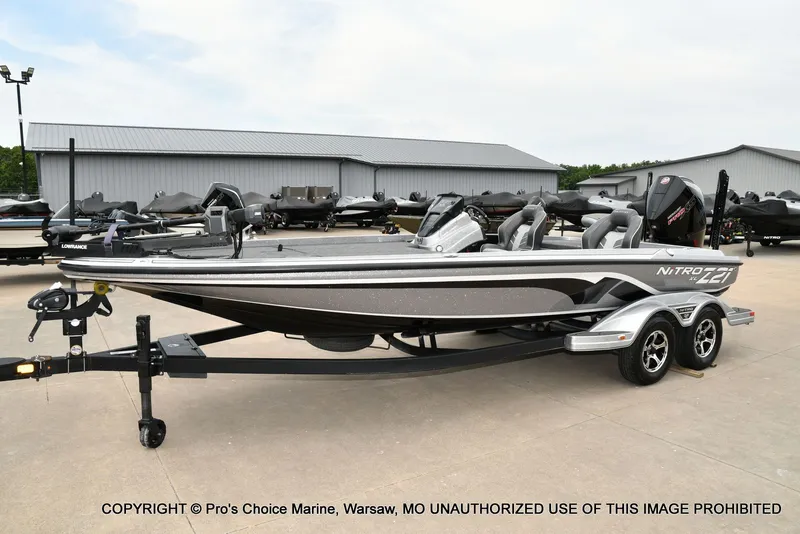 Slide: The Image of 2024 Nitro Z21 XL Pro boat on trailer outdoors. - 28