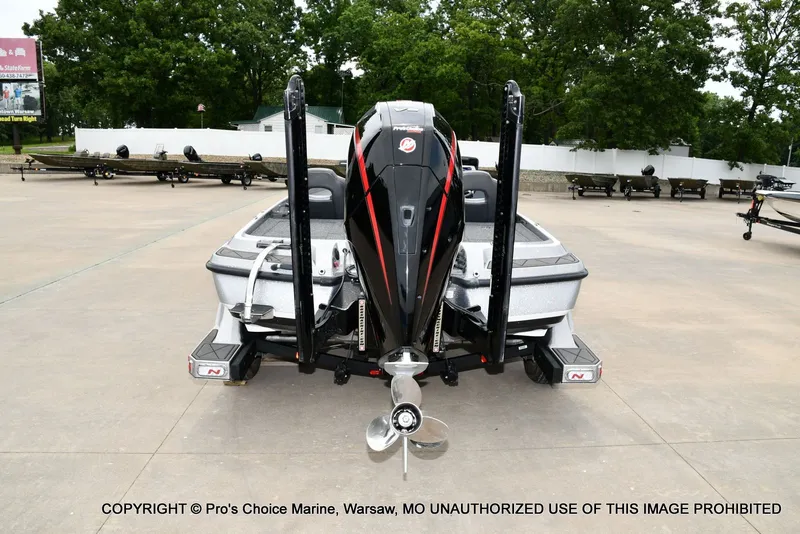 Slide: The Image of Rear view of 2024 Nitro Z21 XL Pro boat on a parking lot. - 8