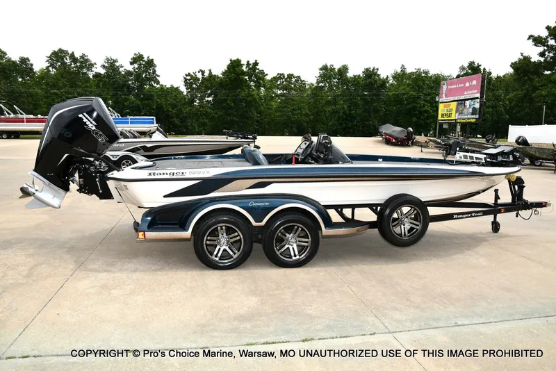 Slide: The Image of 2002 Ranger 522vx boat with 250HP Pro-XS 4 Stroke engine on trailer. - 18