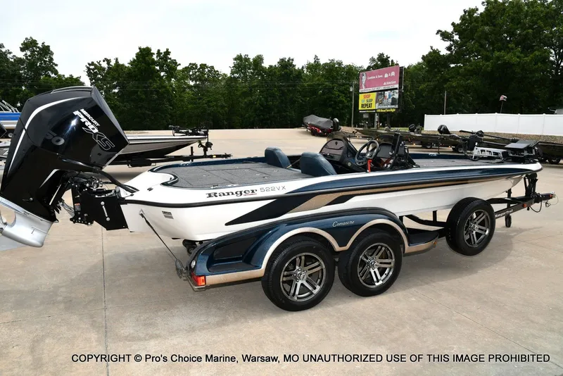 Slide: The Image of 2002 Ranger 522vx boat with 250HP Pro-XS 4 Stroke engine on parking lot. - 26
