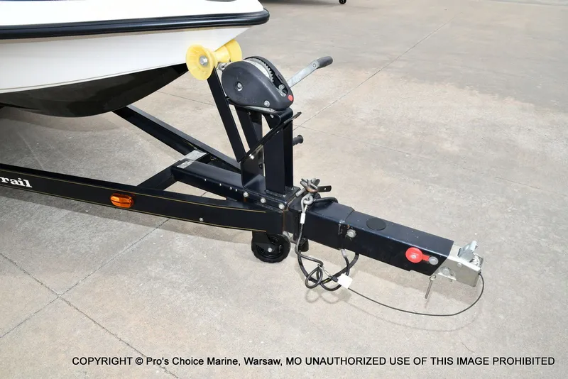 Slide: The Image of Trailer of a 2002 Ranger 522vx boat on concrete surface. - 42