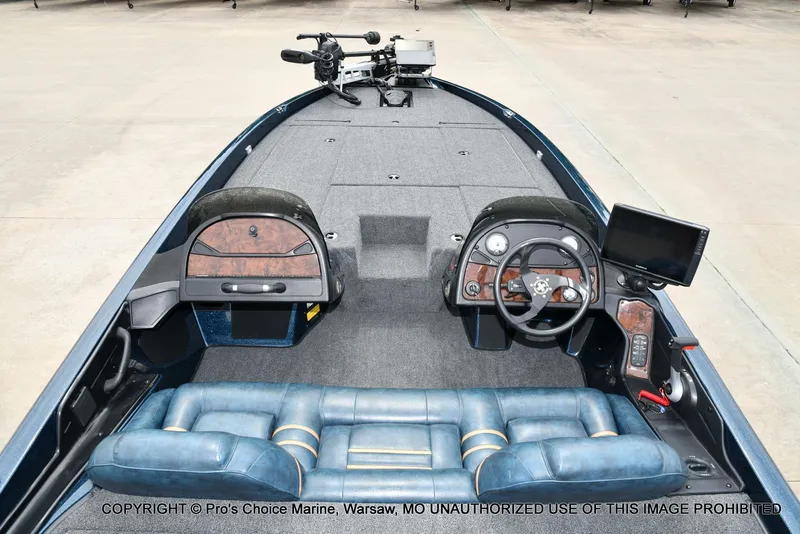 Slide: The Image of Interior view of a 2002 Ranger 522vx boat with steering console. - 8