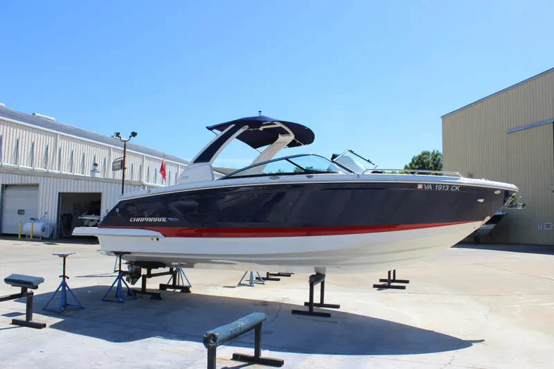 The Image of 2020 Chaparral 277 SSX boat on stands in a marina setting. - 0