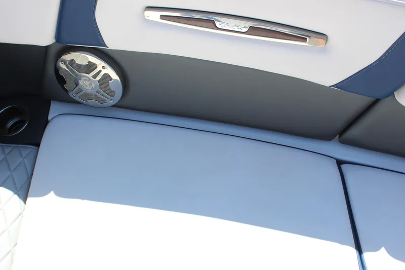 Slide: The Image of Interior of 2020 Chaparral 277 SSX boat with speaker and cushioned seating. - 13