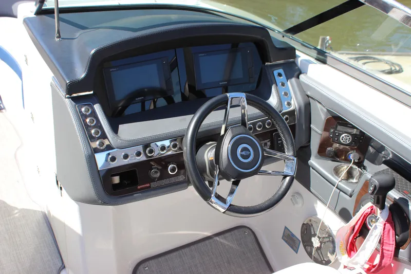 Slide: The Image of Cockpit of 2020 Chaparral 277 SSX boat with modern steering and dual displays. - 14