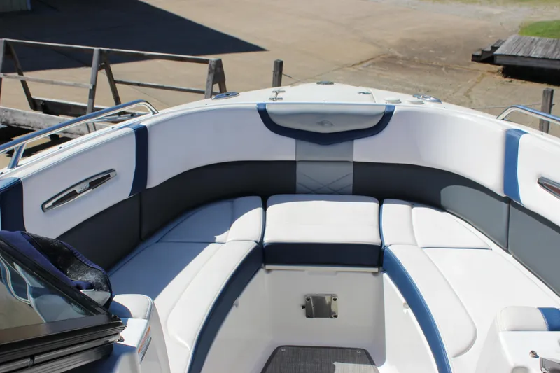 Slide: The Image of 2020 Chaparral 277 SSX boat interior with white and blue seating arrangement. - 23