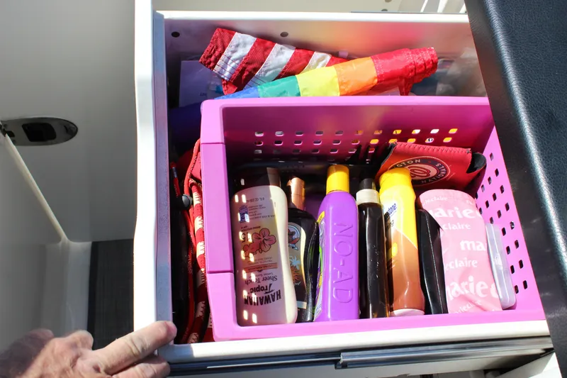 Slide: The Image of Drawer on 2020 Chaparral 277 SSX boat with sunscreen and accessories in pink organizer. - 29