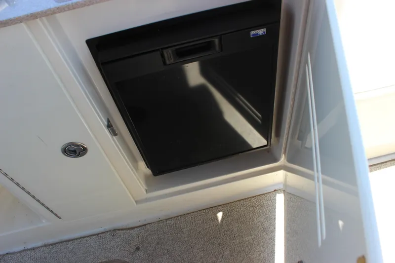 Slide: The Image of Compact refrigerator in 2007 Sea Ray 270 Sundeck boat interior. - 10