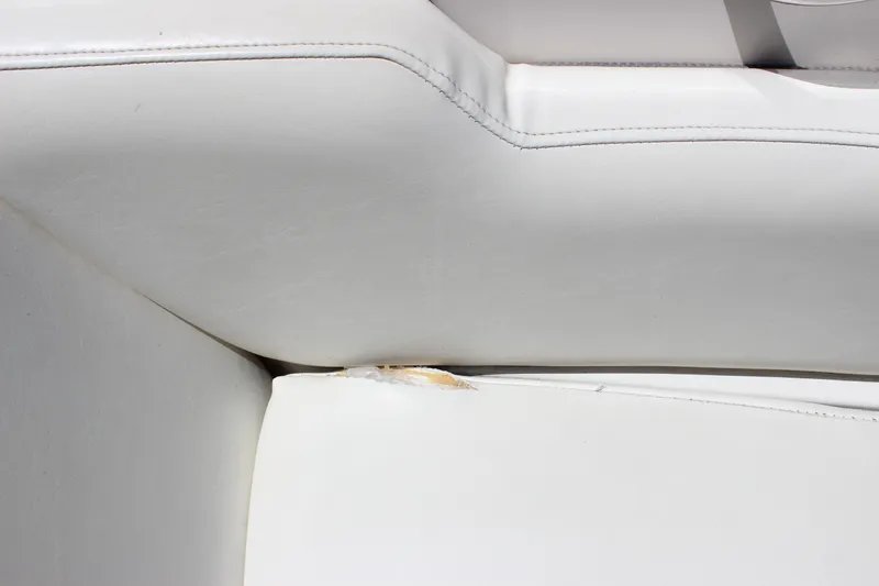 Slide: The Image of Close-up of 2007 Sea Ray 270 Sundeck white upholstery with visible tear. - 12