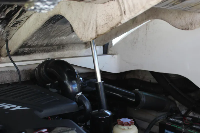 Slide: The Image of Engine compartment of a 2007 Sea Ray 270 Sundeck boat, showing mechanical components. - 15