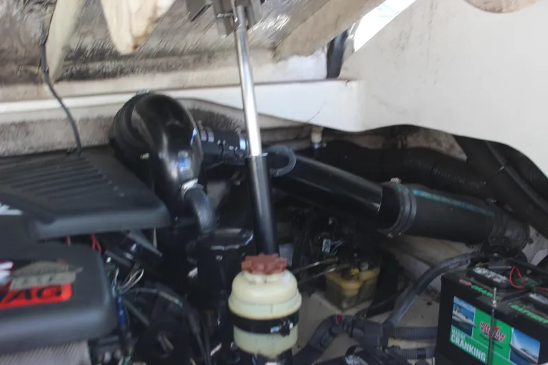Slide: The Image of Engine compartment of a 2007 Sea Ray 270 Sundeck boat, showing various mechanical components. - 16
