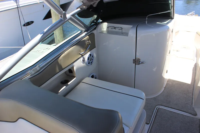 Slide: The Image of 2007 Sea Ray 270 Sundeck interior with seating and storage compartments. - 2