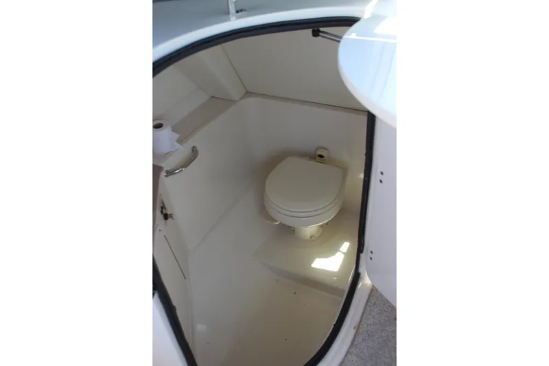 Slide: The Image of 2007 Sea Ray 270 Sundeck boat bathroom interior with toilet and toilet paper holder. - 22