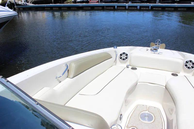 Slide: The Image of 2007 Sea Ray 270 Sundeck boat interior with white seating and water view. - 3
