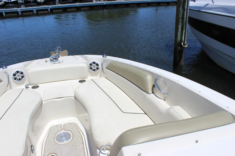Slide: The Image of 2007 Sea Ray 270 Sundeck boat interior with beige seating and water view. - 4