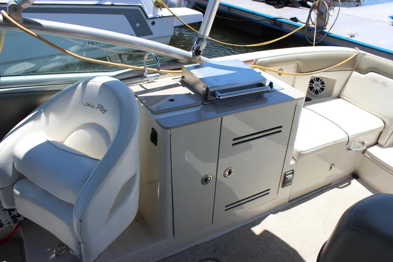 Slide: The Image of Interior of a 2007 Sea Ray 270 Sundeck boat with seating and storage. - 8