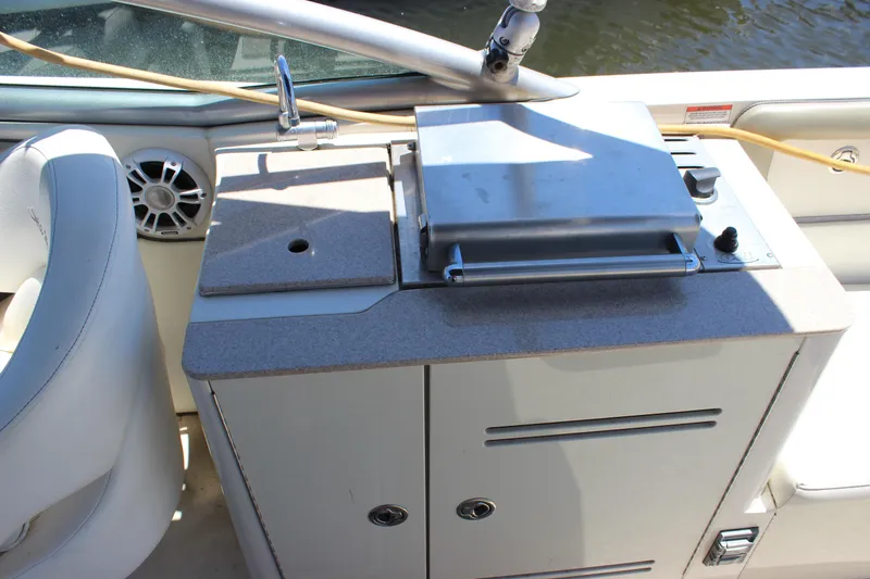 Slide: The Image of 2007 Sea Ray 270 Sundeck boat kitchenette with grill and sink. - 9
