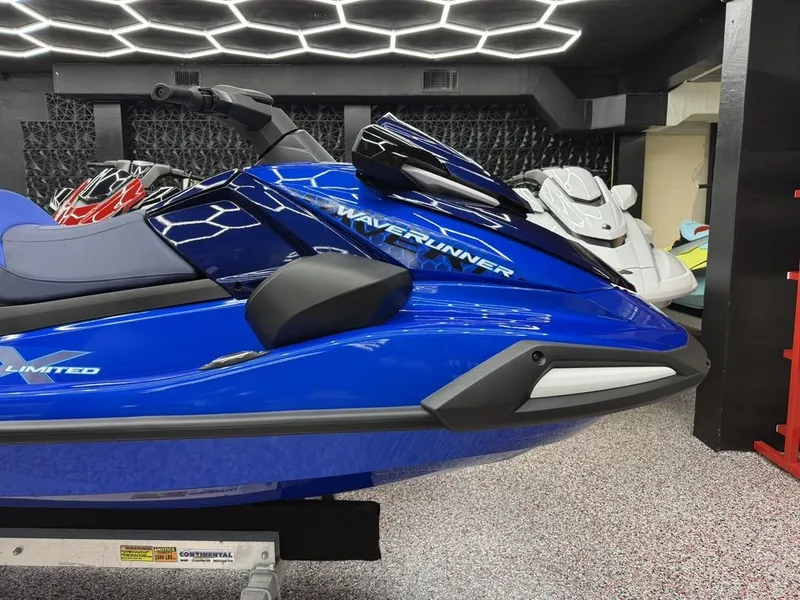Slide: The Image of 2026 Yamaha WaveRunners VX1050AC in blue design in showroom. - 3