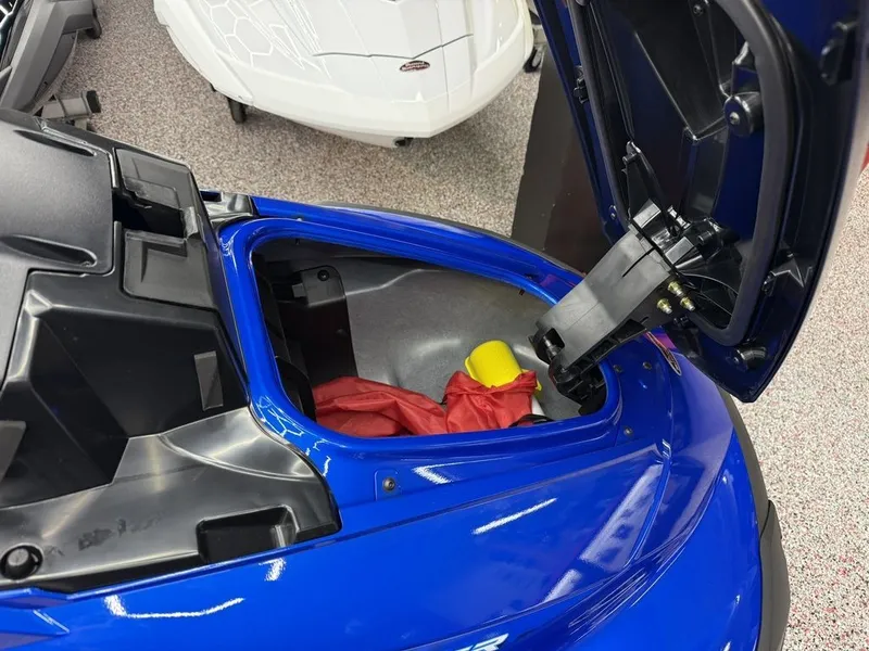 Slide: The Image of Open storage compartment of a blue 2026 Yamaha WaveRunner VX1050AC. - 5