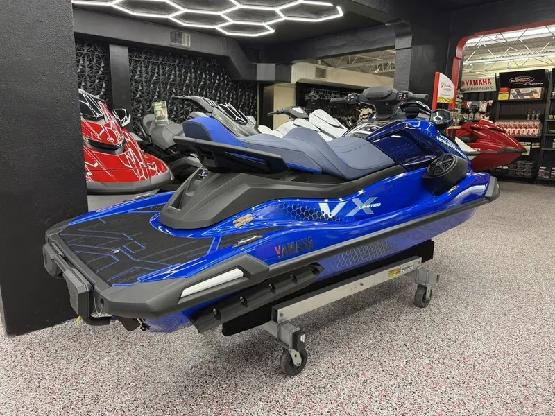 Slide: The Image of 2026 Yamaha WaveRunners VX1050AC in blue displayed in showroom. - 8