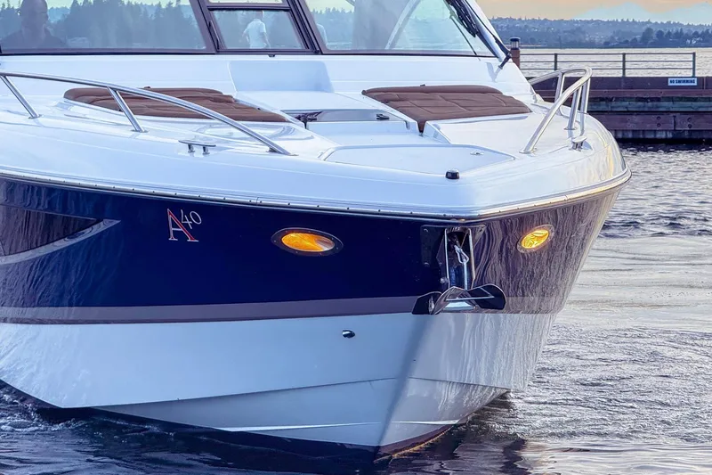 Slide: The Image of 2017 Cobalt A40 Coupe boat on water, featuring sleek design and modern amenities. - 19