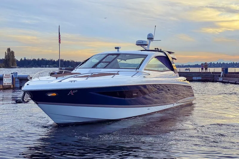 Slide: The Image of 2017 Cobalt A40 Coupe yacht docked at sunset, showcasing sleek design and luxury features. - 23