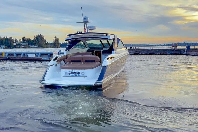 Slide: The Image of 2017 Cobalt A40 Coupe yacht docked at sunset in Seattle marina. - 26