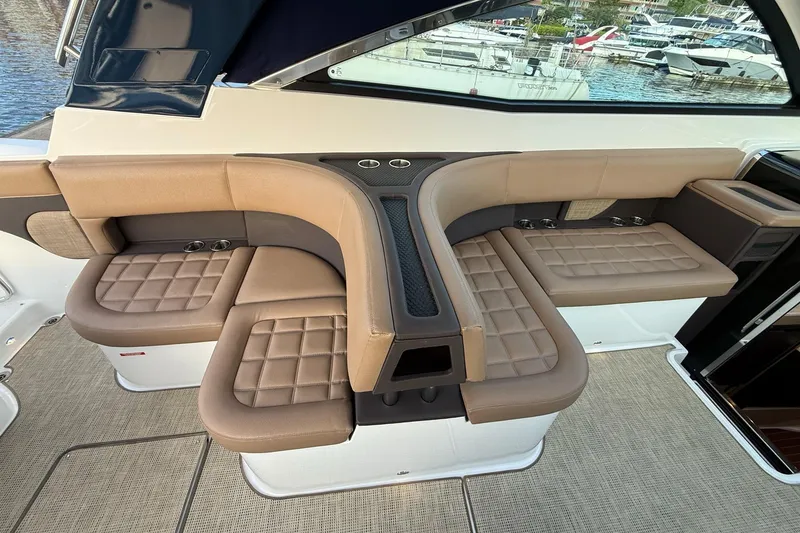 Slide: The Image of Luxurious seating area on a 2017 Cobalt A40 Coupe yacht, featuring quilted leather upholstery. - 33