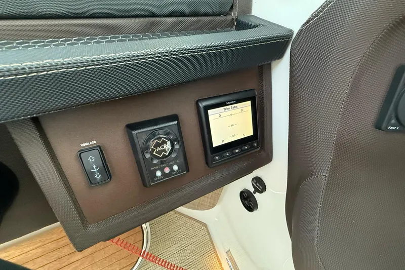 Slide: The Image of Control panel of a 2017 Cobalt A40 Coupe featuring trim tab display and windlass switch. - 40
