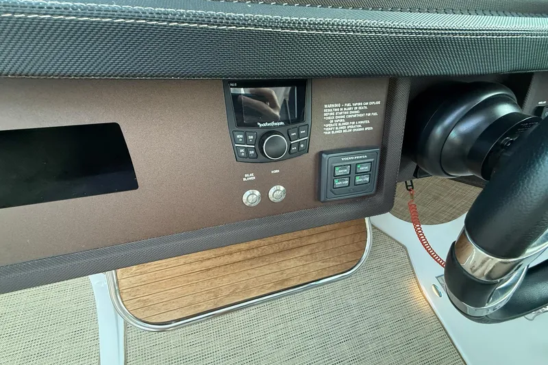 Slide: The Image of Control panel of a 2017 Cobalt A40 Coupe boat with steering wheel and electronic controls. - 43