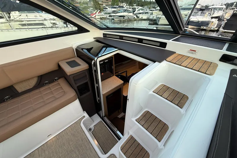 Slide: The Image of Interior view of 2017 Cobalt A40 Coupe yacht with seating and cabin entrance. - 45