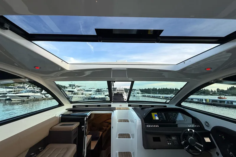 Slide: The Image of Interior view of 2017 Cobalt A40 Coupe yacht with panoramic windows and modern dashboard. - 47