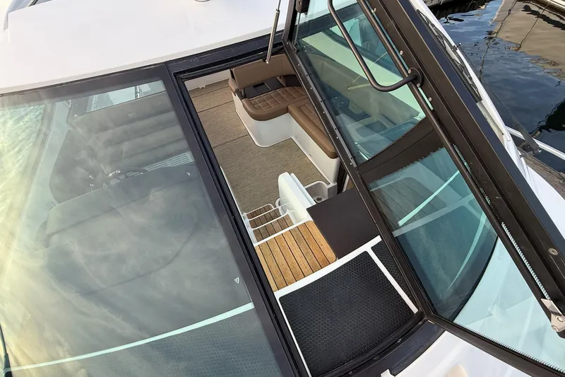 Slide: The Image of 2017 Cobalt A40 Coupe interior view with brown seating and glass doors. - 55