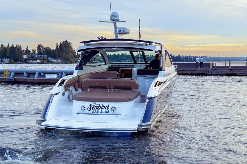 Slide: The Image of 2017 Cobalt A40 Coupe yacht named "Seabird" docked in Seattle, WA at sunset. - 6