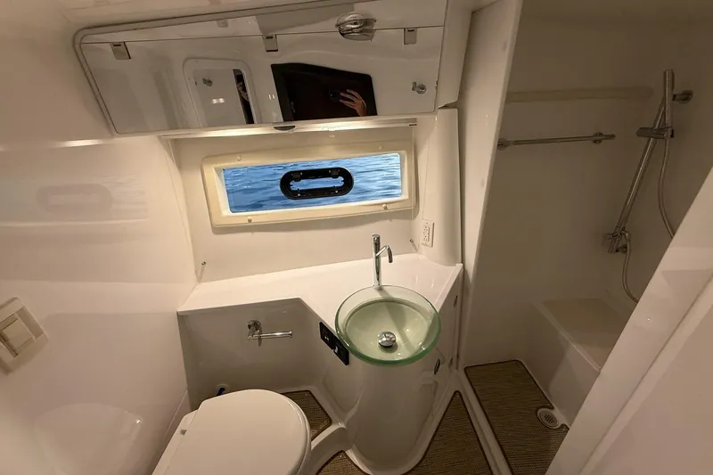 Slide: The Image of Luxurious bathroom in 2017 Cobalt A40 Coupe yacht with modern fixtures and ocean view. - 63
