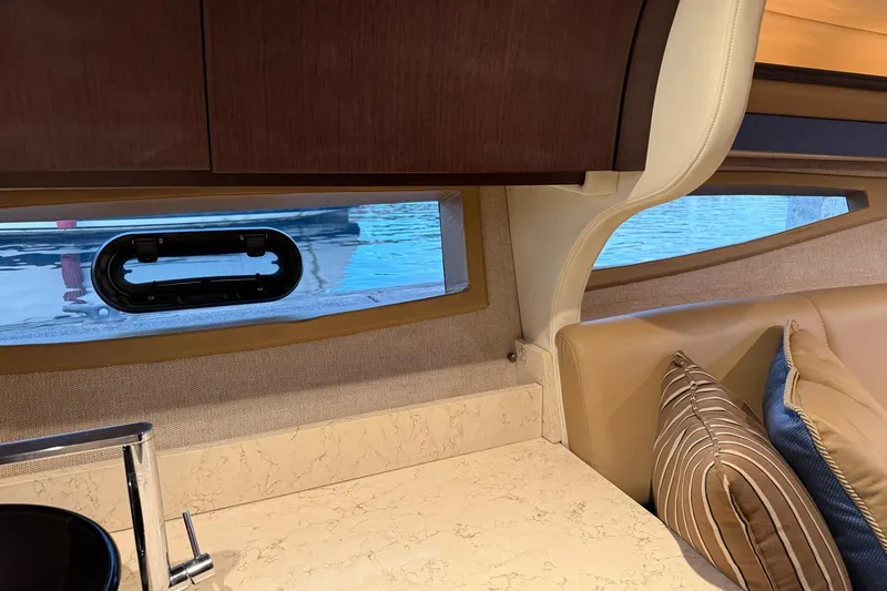 Slide: The Image of Interior of 2017 Cobalt A40 Coupe with window view, countertop, and cushions. - 64