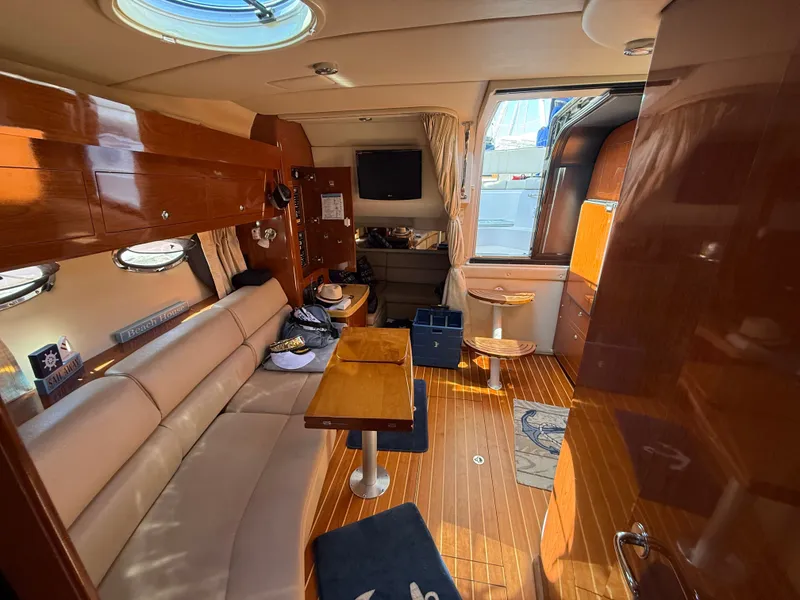 Slide: The Image of Interior of a 2009 Regal Commodore 3760 IO yacht with wooden flooring. - 13