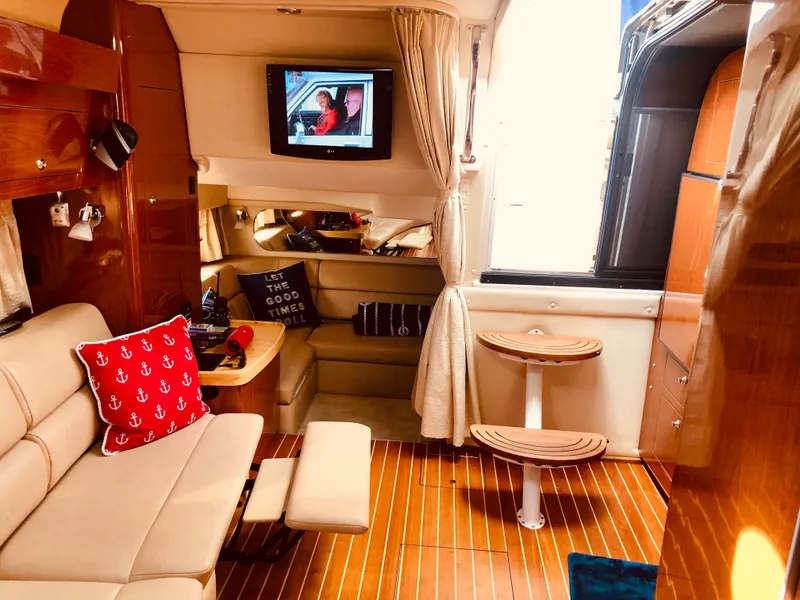 Slide: The Image of Interior of a 2009 Regal Commodore 3760 IO yacht with cozy furnishings. - 15