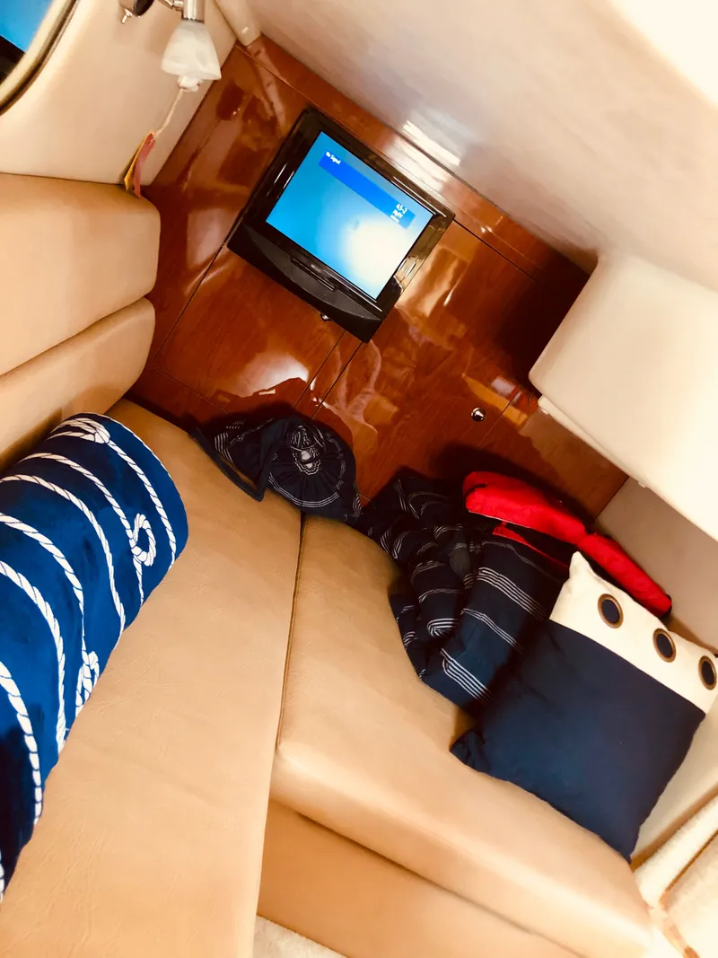 Slide: The Image of Interior of 2009 Regal Commodore 3760 IO with TV and cushions. - 22