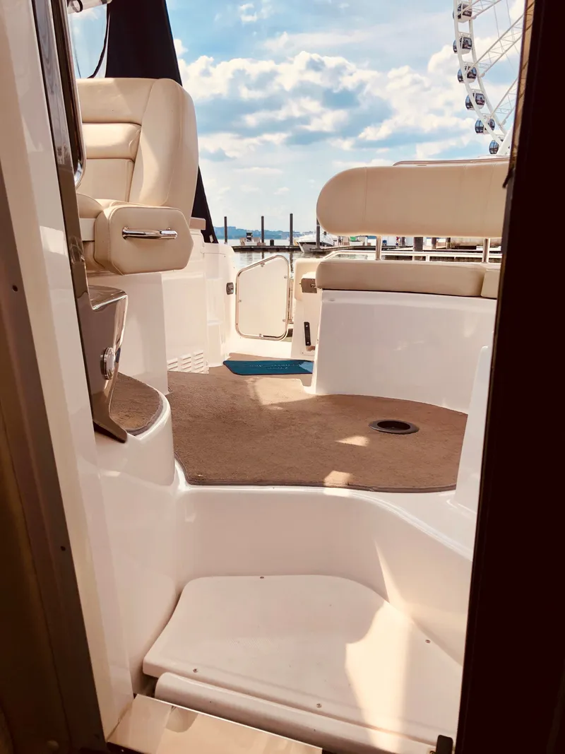 Slide: The Image of Interior of a 2009 Regal Commodore 3760 IO yacht with seating area. - 26